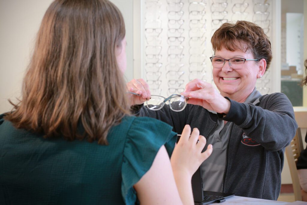 A staff giving a frame to a client